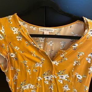 Yellow floral mini sundress with button front and pockets